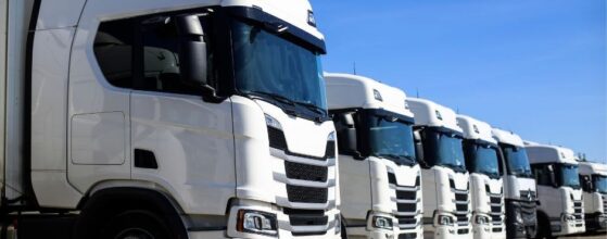 Business van and commercial truck parked side by side representing business vehicle loan options